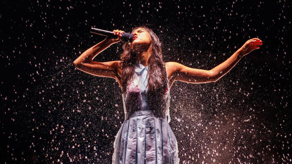 Olivia Rodrigo sings on stage