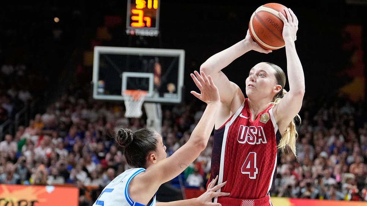 Paige Bueckers shoots over Matilde Villa during Women's Basketball World Cup action.