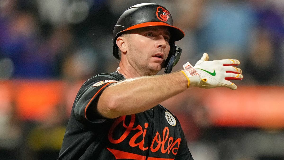 Pete Alonso reacts after hitting a solo home run during a baseball game.