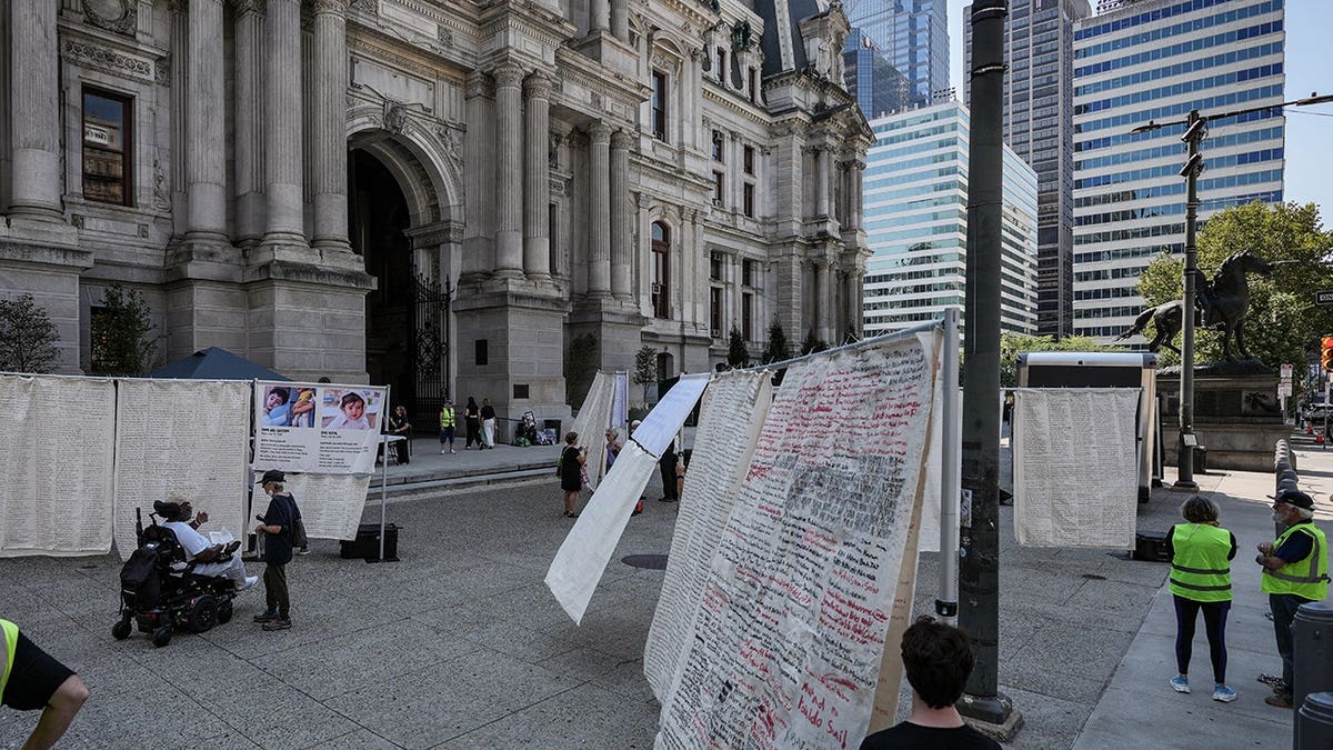 Gaza Children's Shroud with handwritten names displayed at Philadelphia City Hall North.