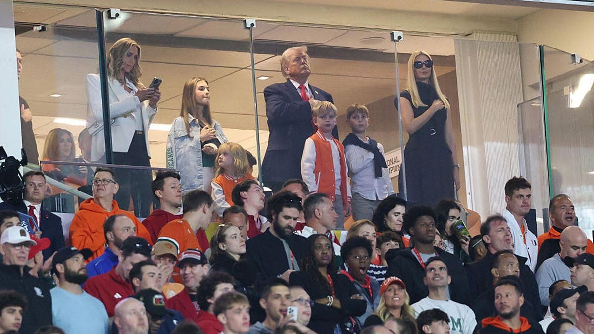 President Donald Trump looks on during the national anthem at Hard Rock Stadium.