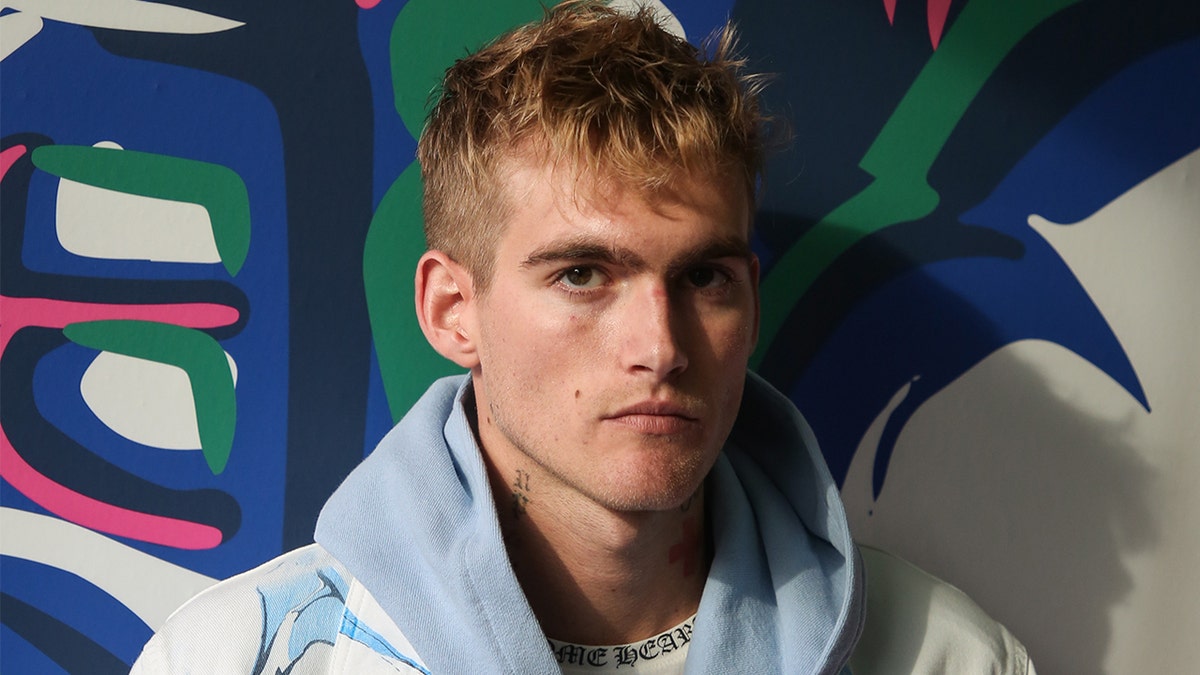Presley Gerber wears hoodie while modeling