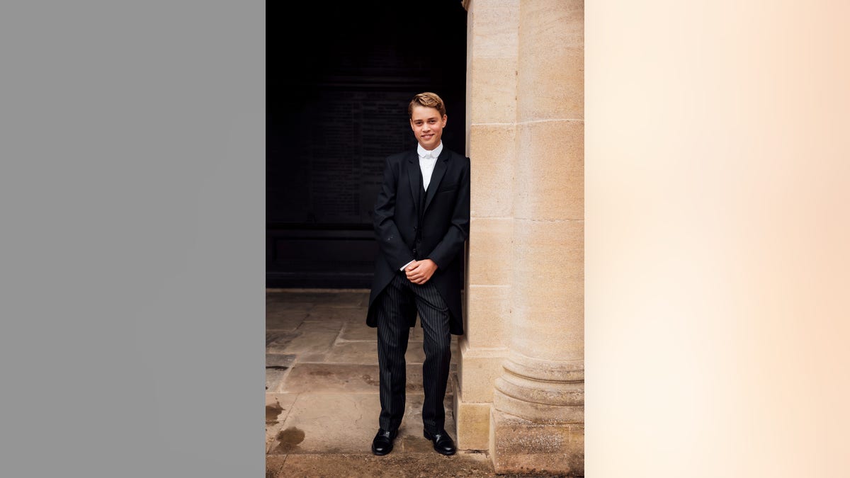 Prince George poses for a photo for his first day at Eaton