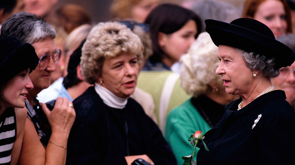 Queen Elizabeth II greets mourners at Princess Diana's funeral.