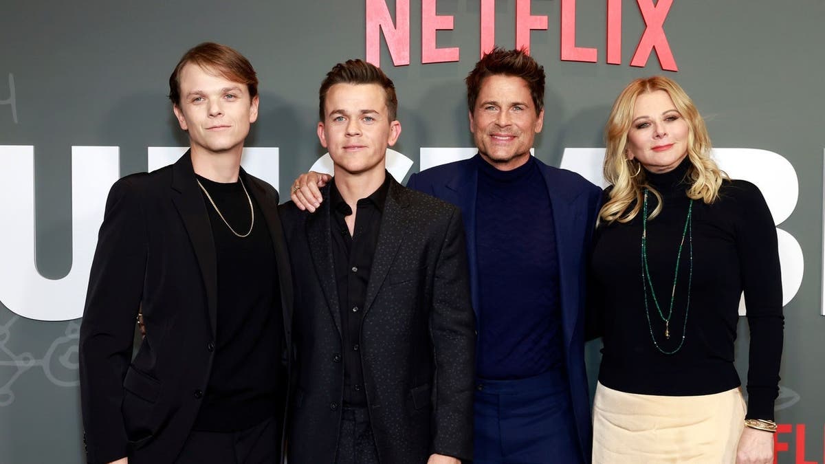 Rob Lowe, Matthew Edward Lowe, John Owen Lowe and Sheryl Berkoff stand together at a premiere event.