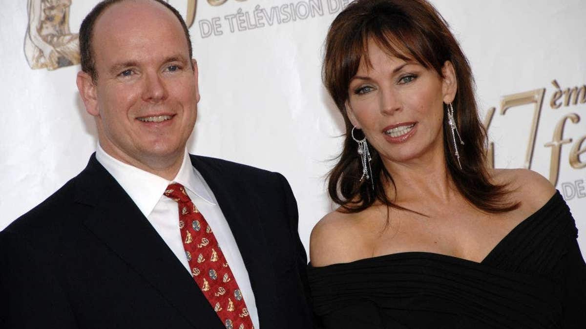 Robert Knepper, Prince Albert II of Monaco, Lesley Anne Down, and Eric Close stand together at an opening-night event.