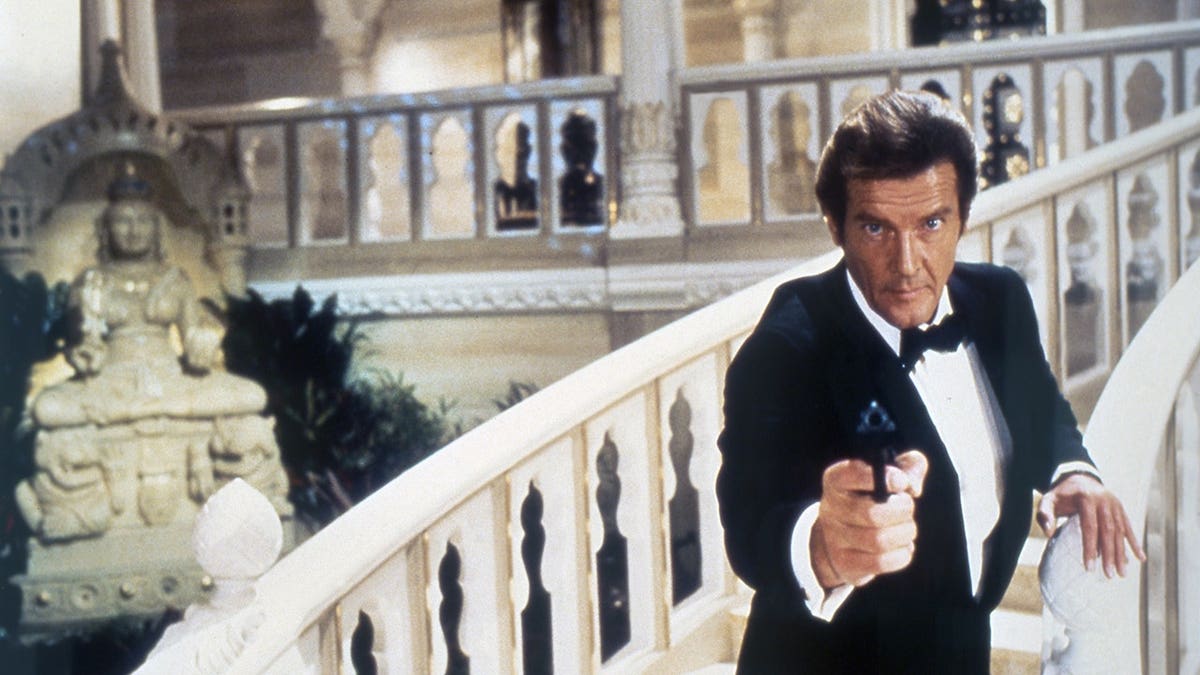 Roger Moore stands on the set of Octopussy.