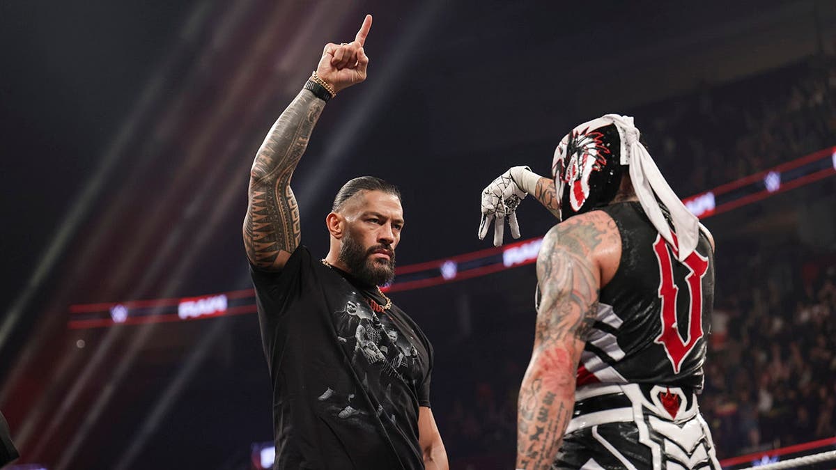Roman Reigns and Penta face off in the ring during Monday Night RAW.