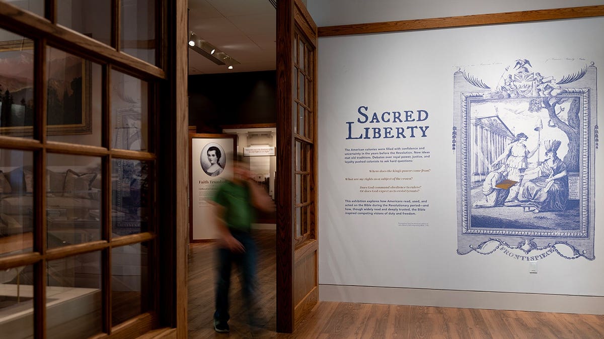 A visitor exits the Sacred Liberty exhibition at the Museum of the Bible in Washington, D.C.