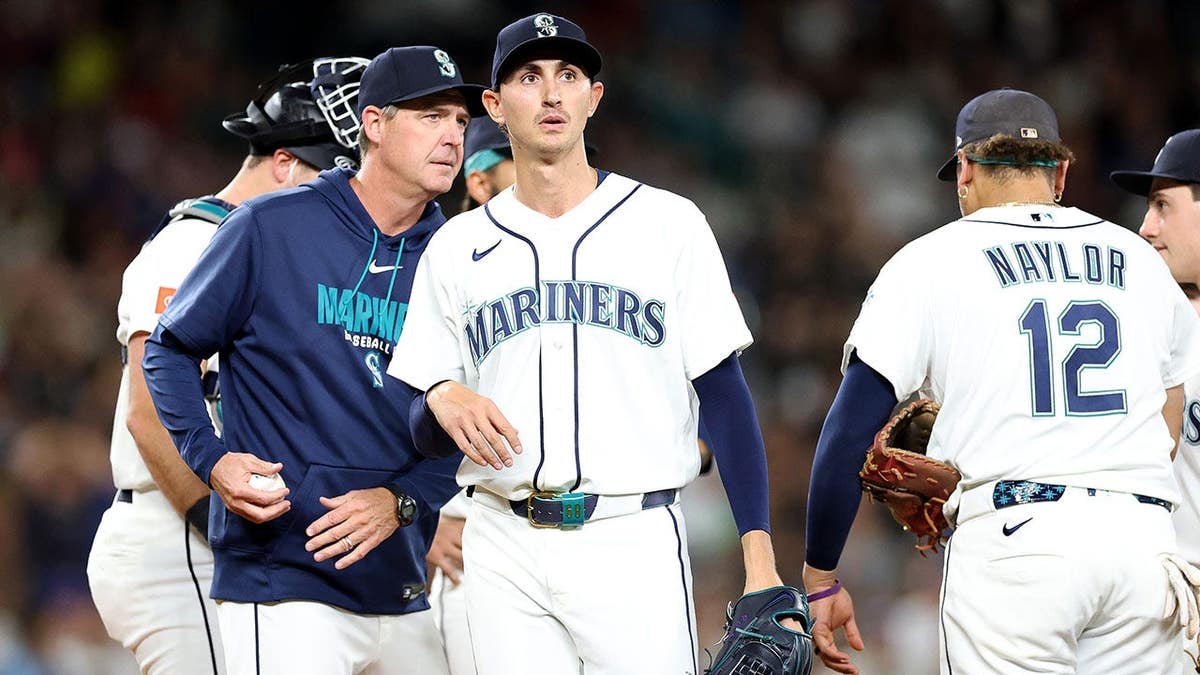 Manager Dan Wilson removes pitcher George Kirby during a Mariners game at T-Mobile Park.