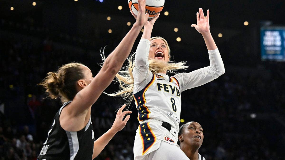 Sophie Cunningham of the Indiana Fever drives to the basket during a WNBA playoff game.