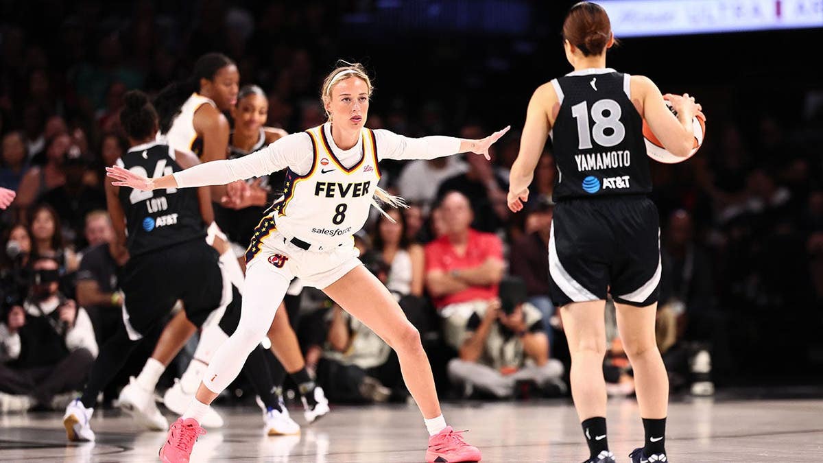 Sophie Cunningham #8 of the Indiana Fever plays defense during a WNBA playoff game.