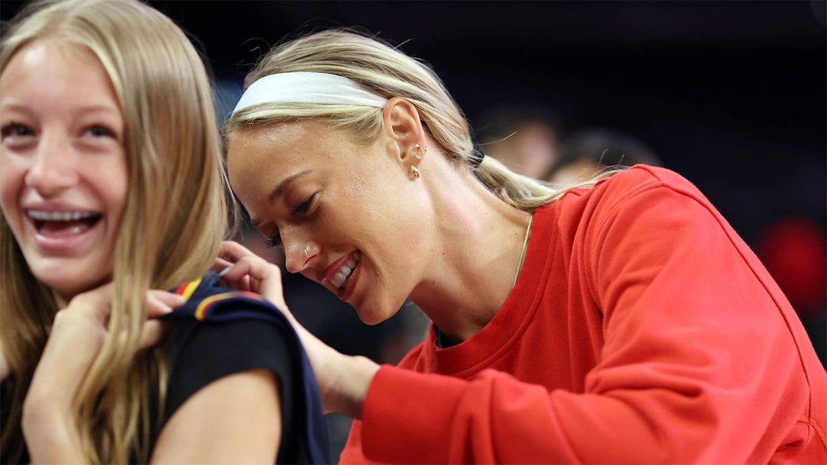 Sophie Cunningham signing an autograph