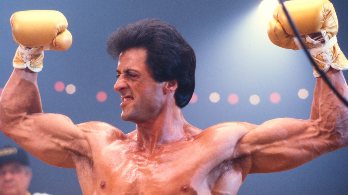  Actor Sylvester Stallone, as Rocky Balboa, shows off his muscles in the boxing ring on the set of Rocky III in May of 1982 in Los Angeles, California. (Photo by James Drake/Getty Images)