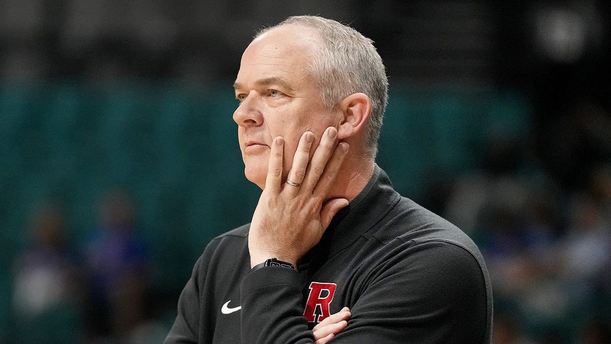 Steve Pikiell, Rutgers head coach, looks on during a basketball game.