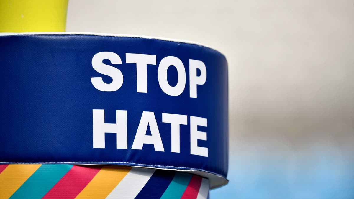 Stop hate banner displayed on a goalpost at Bank of America Stadium before a Carolina Panthers game.