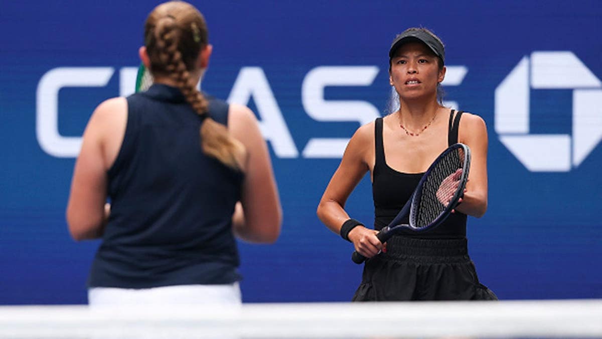 Su-Wei Hsieh and Jelena Ostapenko react during a women's doubles match.
