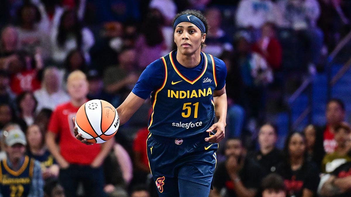 Sydney Colson dribbles the ball during a WNBA preseason game in Atlanta.