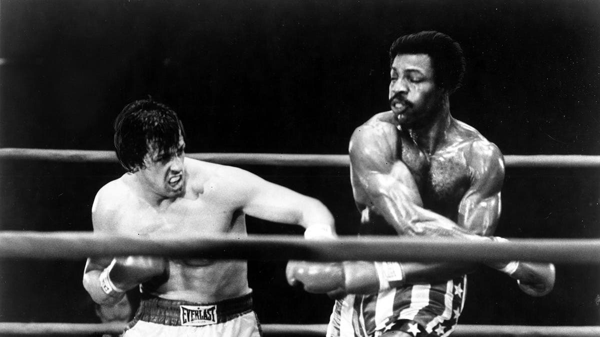Sylvester Stallone and Carl Weathers perform a boxing scene in Rocky.