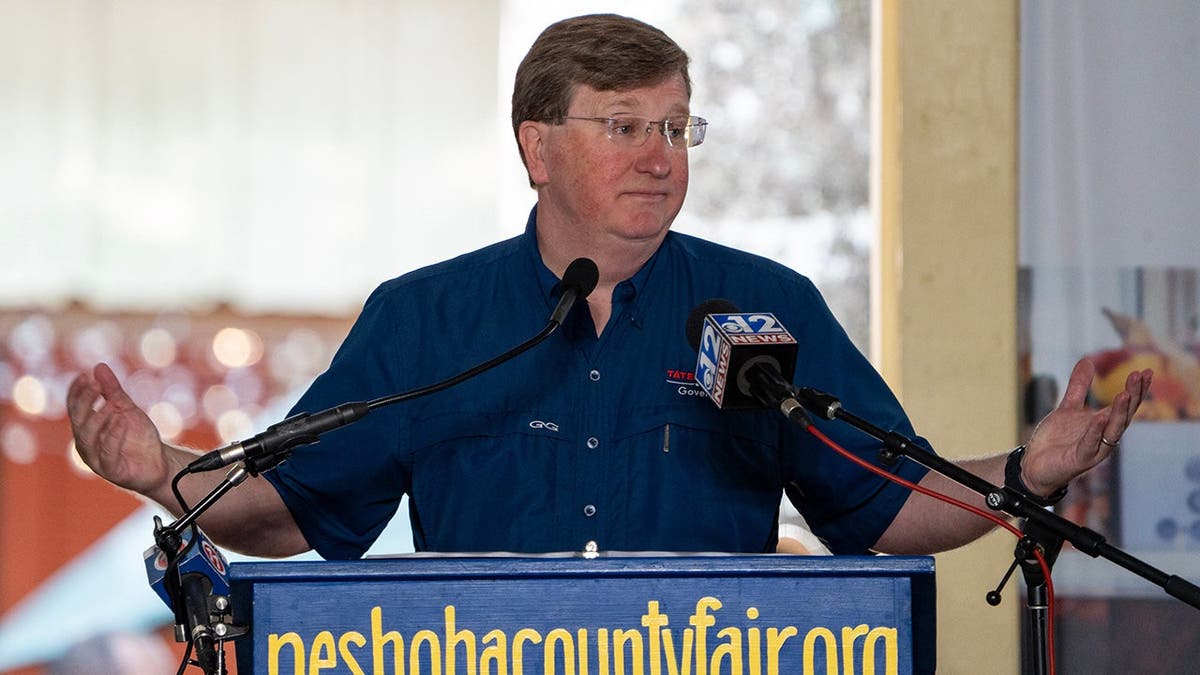 Gov. Tate Reeves gestures while speaking at the Neshoba County Fair in Philadelphia, Mississippi.