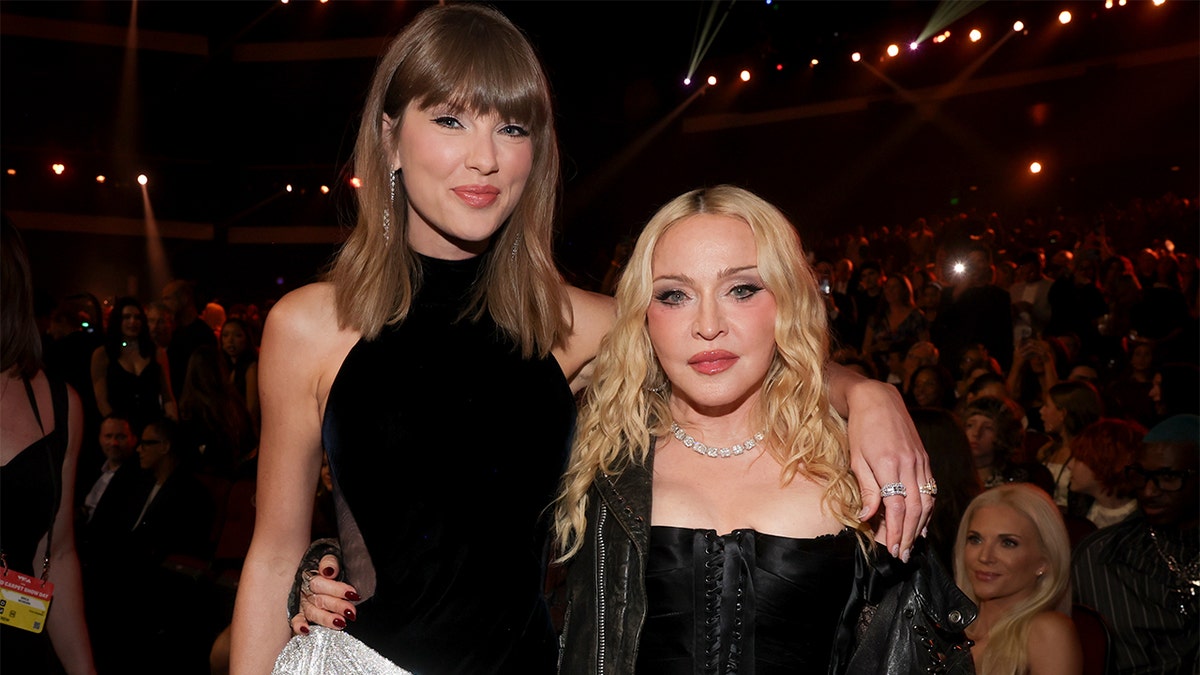 Taylor Swift and Madonna posing