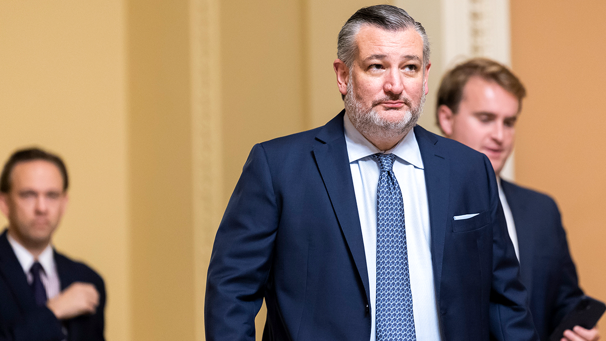 Sen. Ted Cruz walks through hallway at the U.S. Capitol.