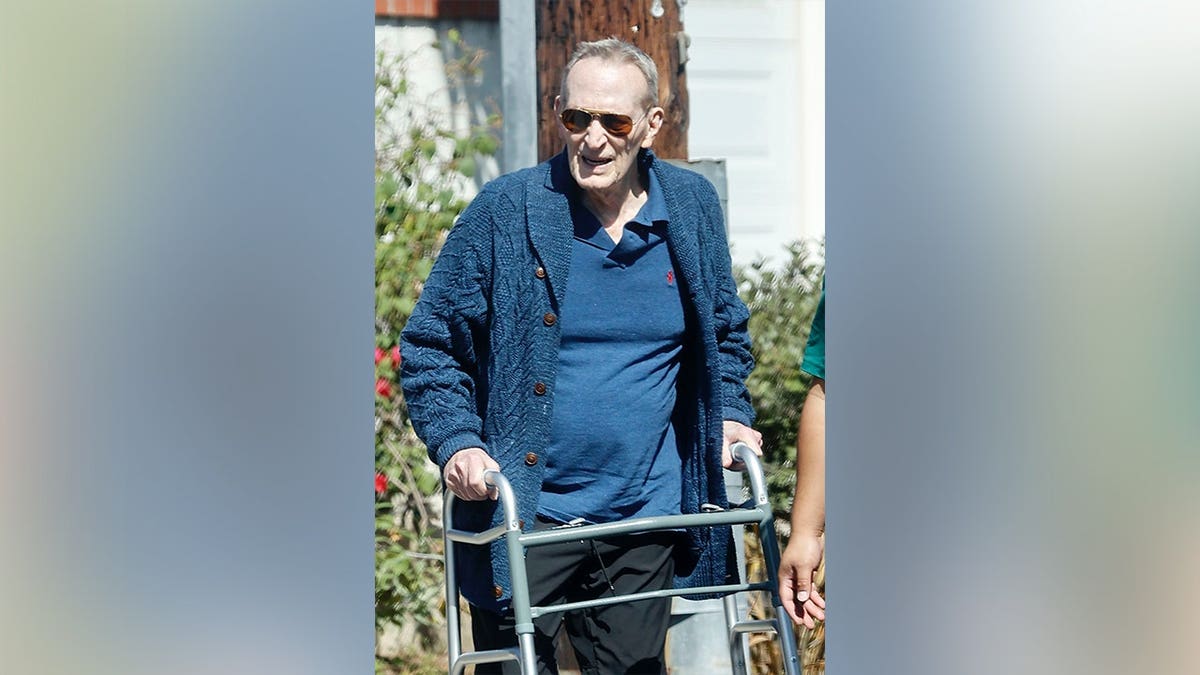 Ted Shackelford in a blue shirt and cardigan while out in Los Angeles.
