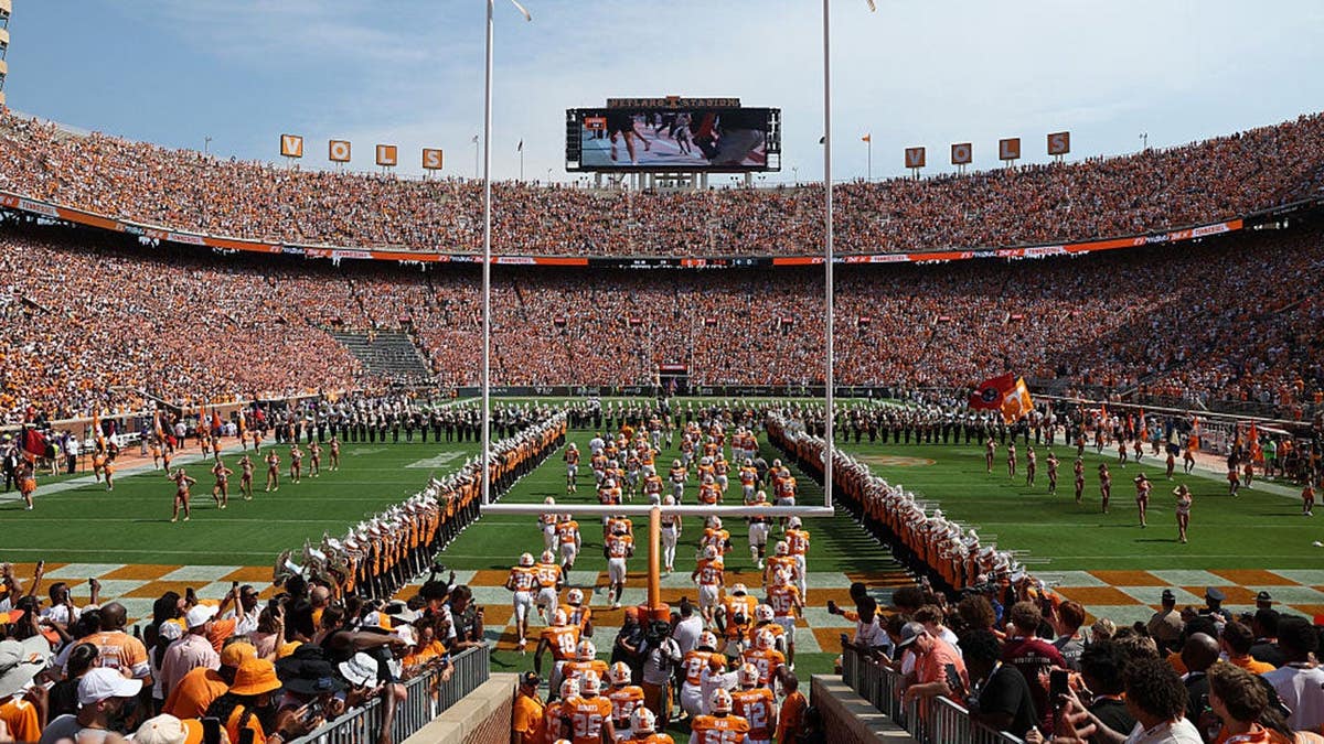 Tennessee Volunteers run out at Neyland Stadium before a game against Furman Paladins.