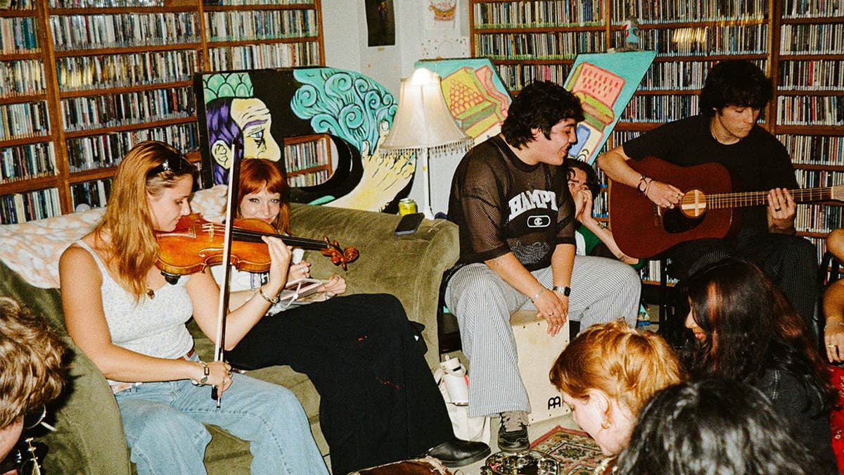 University of Texas students, including Anna Buendia, center with black shirt and no instrument, gather for daily jam sessions at Buendia's house, known as
