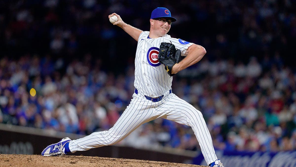Trent Thornton pitches for the Chicago Cubs against the Cincinnati Reds at Wrigley Field.