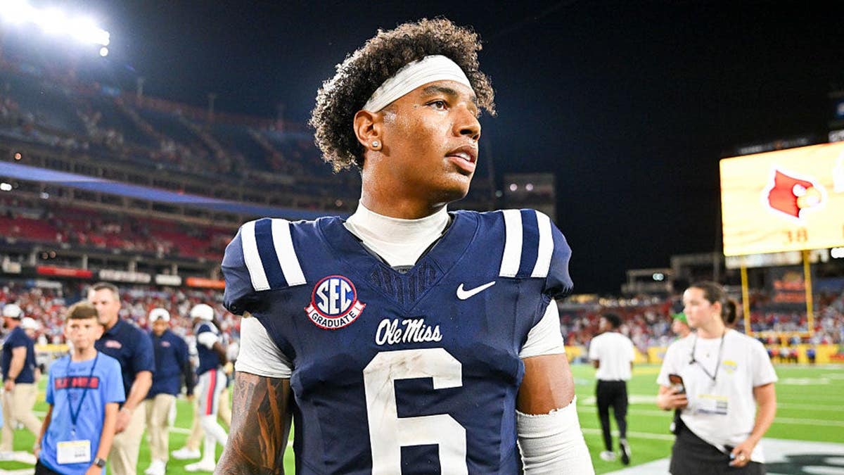 Trinidad Chambliss #6 walks off the field after Ole Miss beats Louisville.