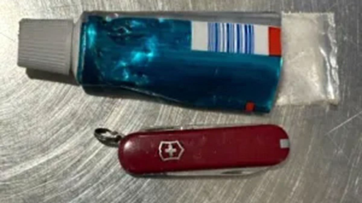 Toothpaste tube and a pocketknife.