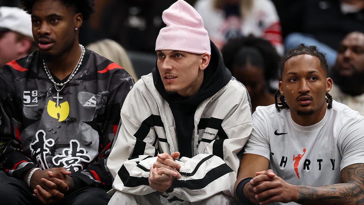Tyler Herro sits on the bench in street clothes during a Miami Heat game against the Washington Wizards. Tyler Herro sits on the bench in street clothes during a Miami Heat game against the Washington Wizards.