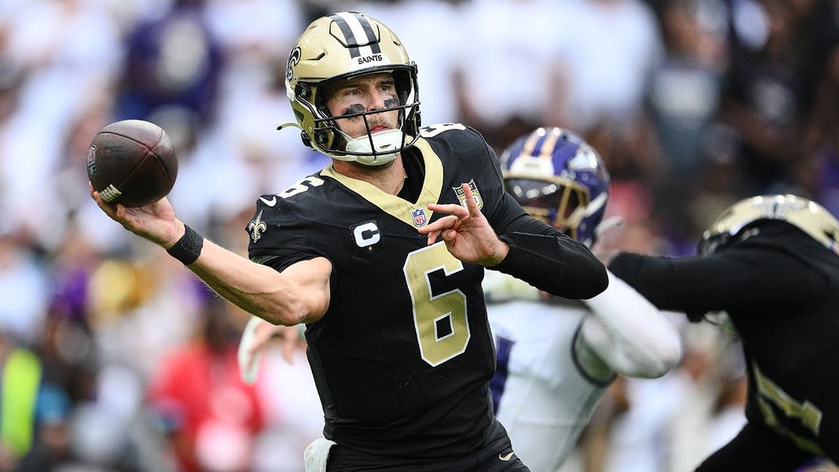 Tyler Shough passes during an NFL game in Baltimore.