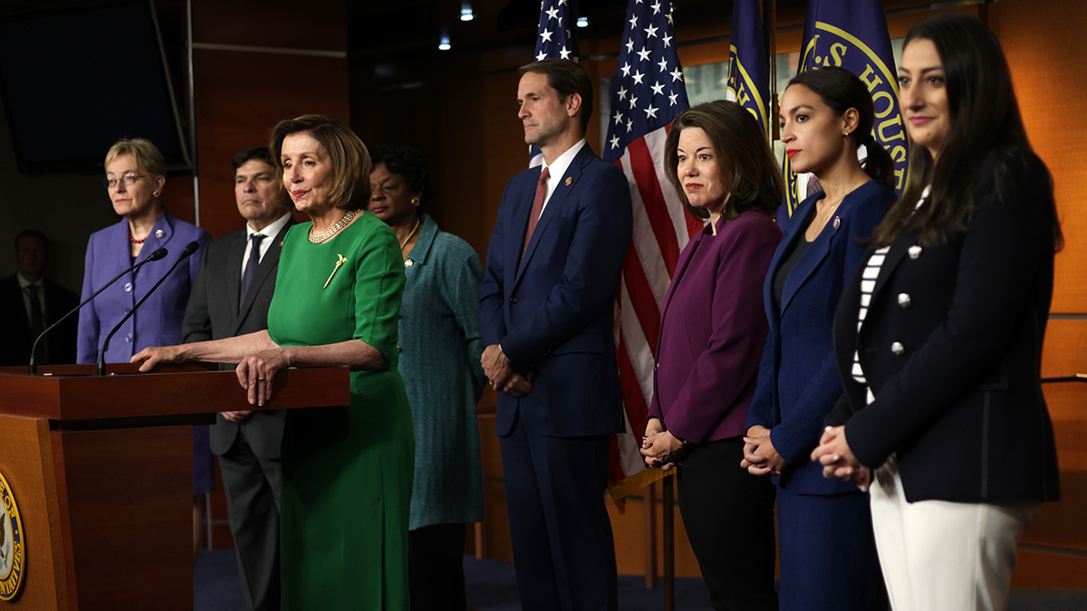 Nancy Pelosi leads a press conference