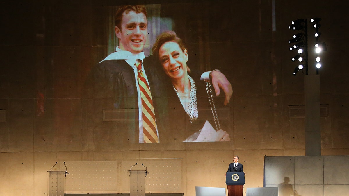 U.S. President Barack Obama speaks about Welles Crowther, pictured on the screen with his mother Alison, during the dedication ceremony at the National September 11 Memorial Museum May 15, 2014 in New York City.