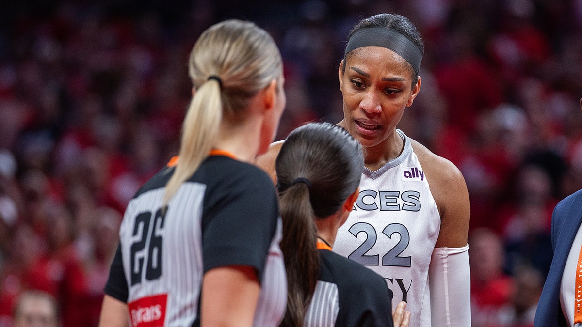 A'ja Wilson speaks to the referees