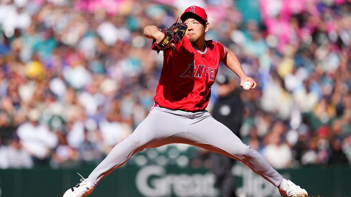 Yusei Kikuchi #16 pitches for the Los Angeles Angels during a game against the Seattle Mariners at T-Mobile Park.