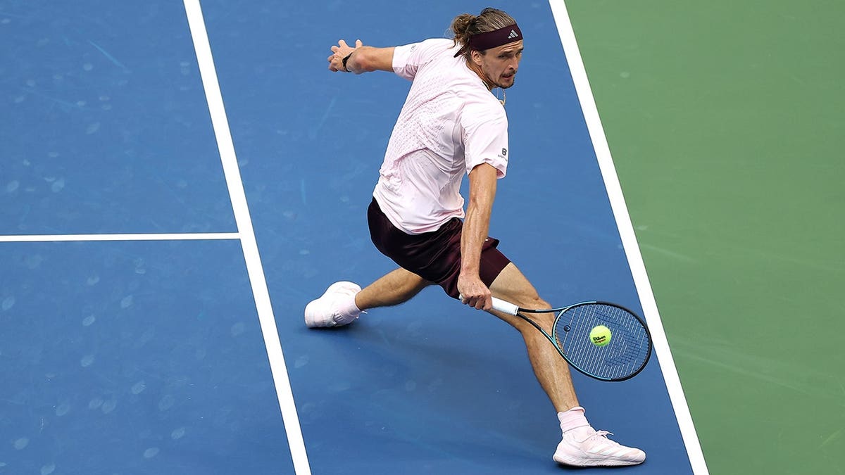 Alexander Zverev of Germany returns a shot against Ben Shelton of the United States during the US Open men's singles final.