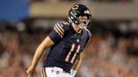 Case Keenum #11 celebrates after a touchdown at Soldier Field.
