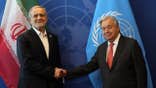 Iranian President Masoud Pezeshkian (L) shakes hands with the United Nations (UN) Secretary General Antonio Guterres