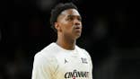 Jizzle James looking on during the first half college basketball game