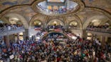 People gather at the Missouri statehouse in Jefferson City on Wednesday, Sept. 10, 2025, to protest the legislature's efforts to change the state's congressional district maps. The proposed change would divide Kansas City into districts that would include vast rural areas of the state.