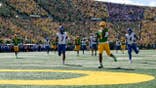 An Oregon player running into the end zone for a touchdown