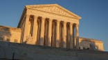 U.S. Supreme Court building glows in sunset light in Washington, D.C.