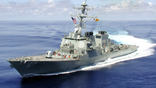 USS Cole sails at sea before 2000 terrorist attack.