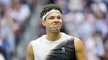 Ben Shelton reacts during a tennis match against Alexander Zverev.