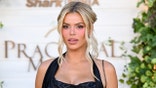 Brooks Nader poses on red carpet.