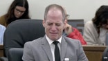 Caleb Flynn sits in an Ohio courtroom with tears on his face during his murder trial in the February 2026 shooting death of his wife, Ashley Flynn.