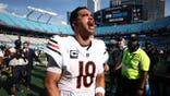 Caleb Williams celebrates on the field after the Chicago Bears' win.